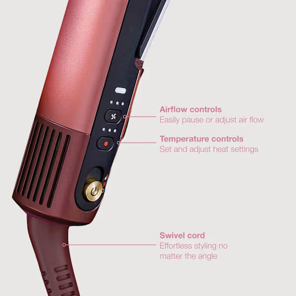 Hair styling tool with airflow and temperature controls on a light gray background