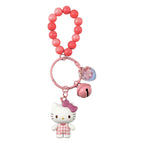 Pink beaded keychain with Hello Kitty charm on a white background