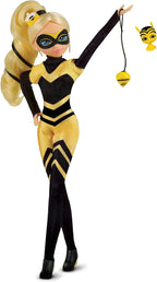 Doll in a yellow and black bee costume with a small bee figure on a white background