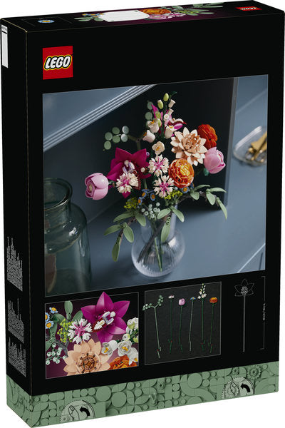 LEGO set packaging with a bouquet of flowers on a table