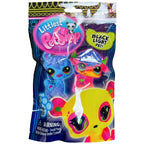 Packaged Littlest Pet Shop toys with black light effect on a white background