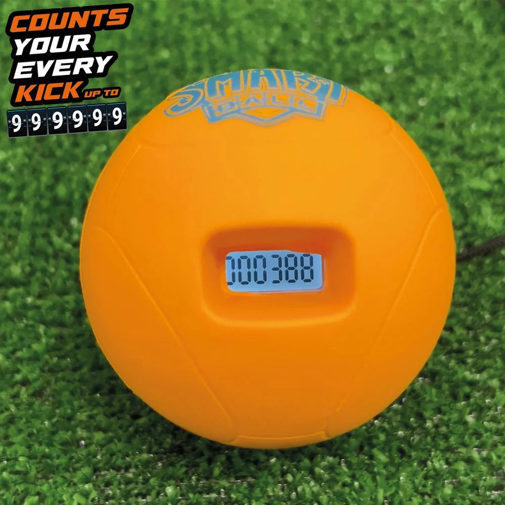 Orange soccer ball with digital counter on a grass field