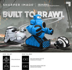Three remote control battle robots with 'Sharper Image' branding and promotional text.