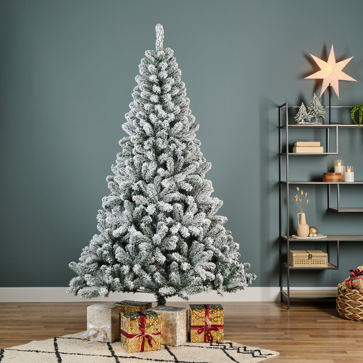Snow-dusted artificial Christmas tree with realistic frosted branches, sturdy stand—available in 6 ft, 7 ft, and 8 ft sizes