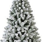 Snow-dusted artificial Christmas tree with realistic frosted branches, sturdy stand—available in 6 ft, 7 ft, and 8 ft sizes