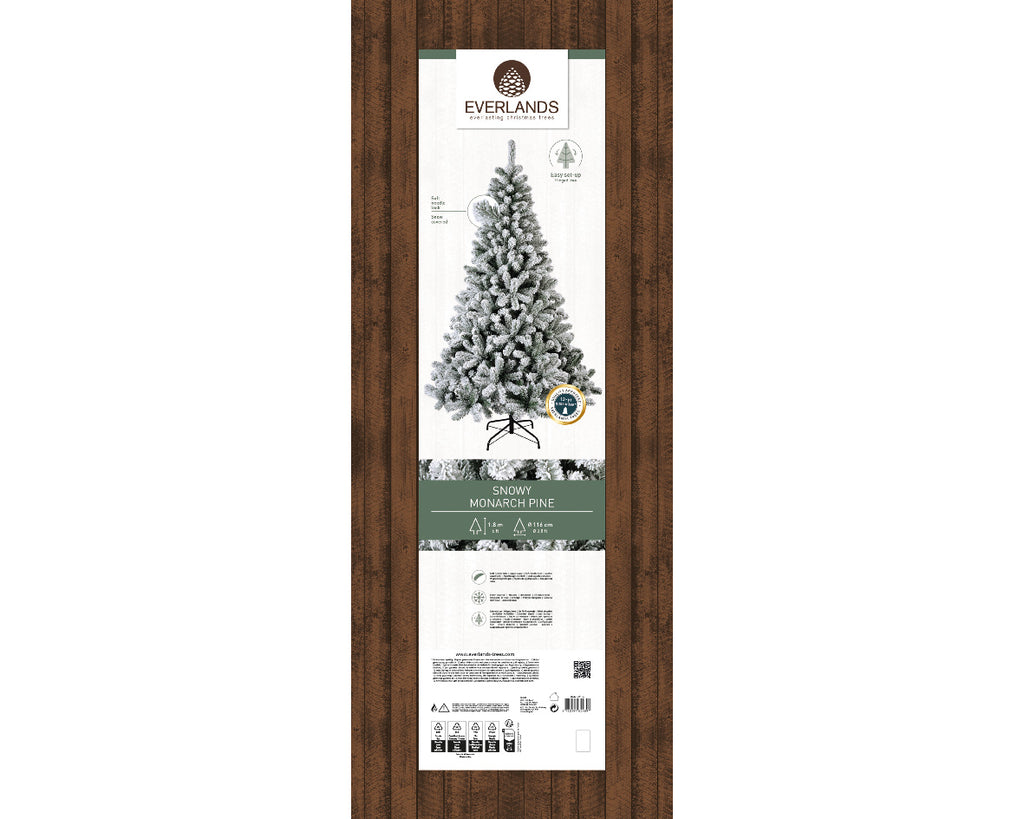 Snow-dusted artificial Christmas tree with realistic frosted branches, sturdy stand—available in 6 ft, 7 ft, and 8 ft sizes