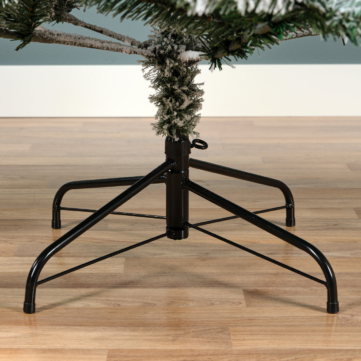 Snow-dusted artificial Christmas tree with realistic frosted branches, sturdy stand—available in 6 ft, 7 ft, and 8 ft sizes