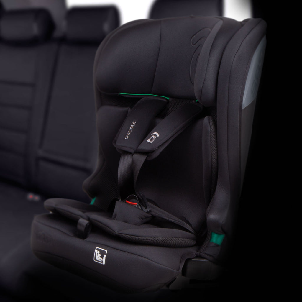 A black infant car seat with a five-point harness, shown installed on a car seat in a vehicle interior. The brand name 'Bebamour' is visible on the shoulder strap.