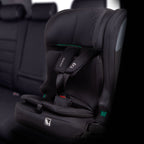 A black infant car seat with a five-point harness, shown installed on a car seat in a vehicle interior. The brand name 'Bebamour' is visible on the shoulder strap.