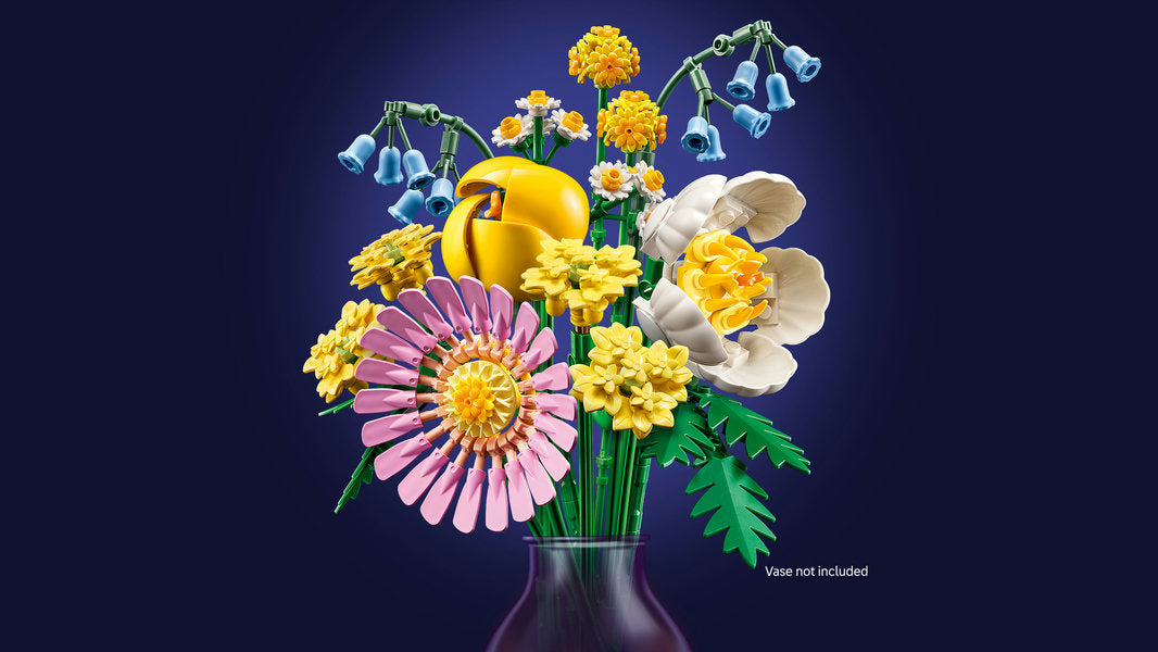 Colorful floral arrangement in a vase on a dark background