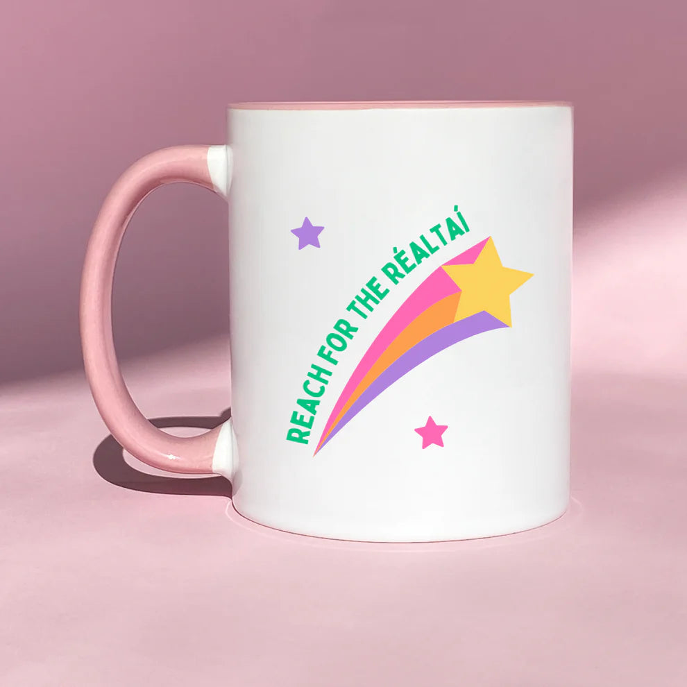 Reach for the Réaltaí ceramic mug with colourful star design and Irish phrase. 11oz Irish gift for dreamers and Gaeilge lovers.