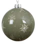 Green Christmas ball ornament with snowflake patterns on a white background
