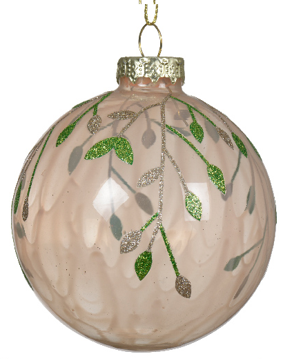 Decorative glass ball ornament with green leaf design on a white background