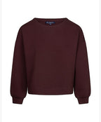 A dark burgundy crewneck sweatshirt with long sleeves and ribbed cuffs, displayed against a plain white background.