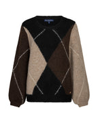 A fuzzy knit crewneck sweater with an argyle pattern in black, dark brown, beige, and medium brown, featuring white dotted diamond lines and a blue 'Ted Baker' label at the collar.
