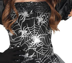 Black dress with white spider web pattern worn by a person