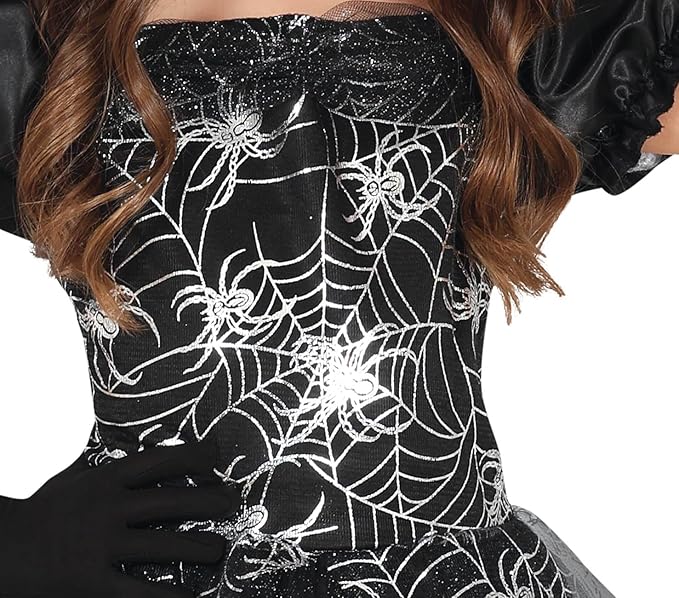 Black dress with white spider web pattern worn by a person