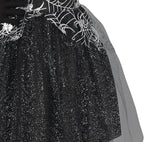 Black glittery dress with spider web and spider designs on a white background
