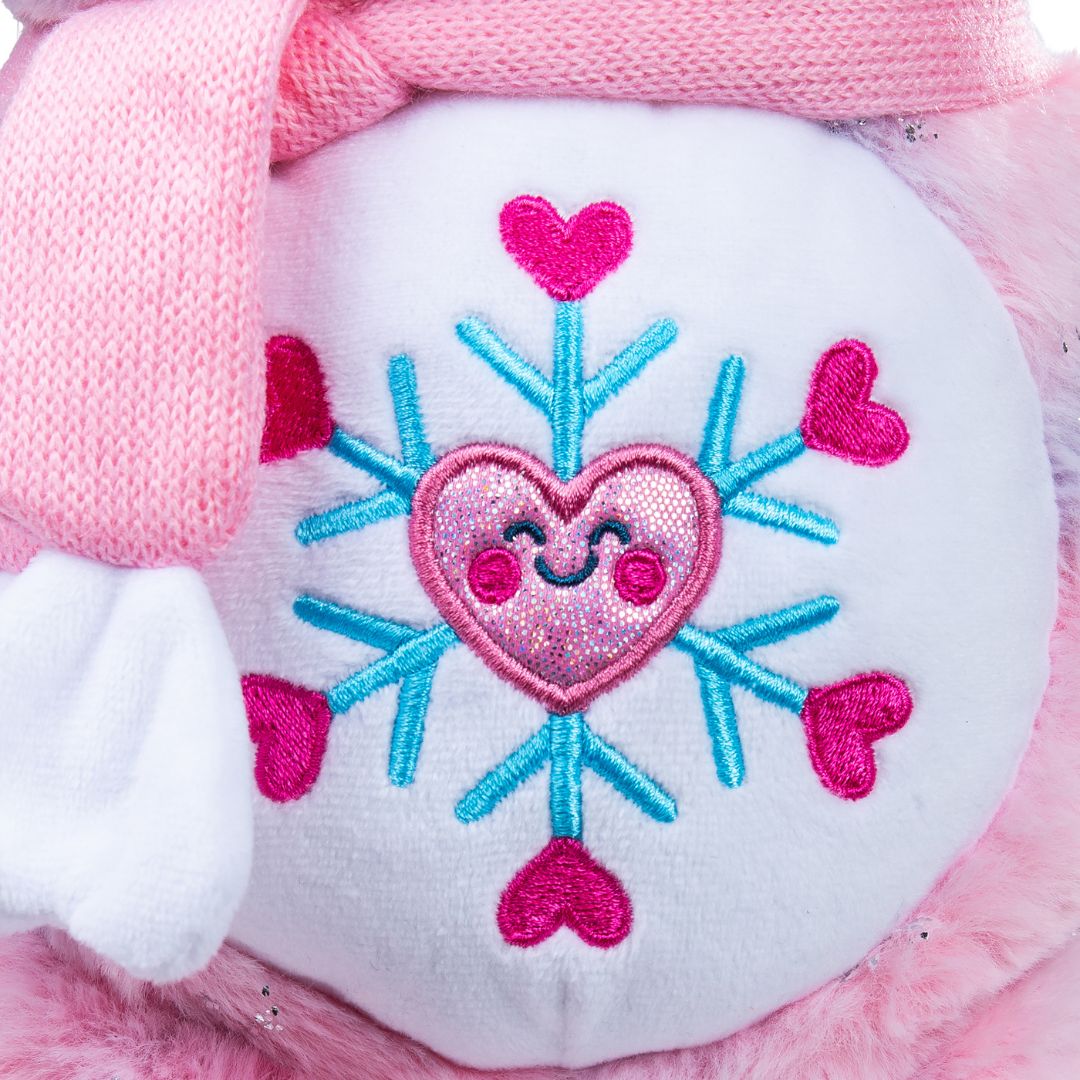 Heart-shaped snowflake design on a pink and white plush toy