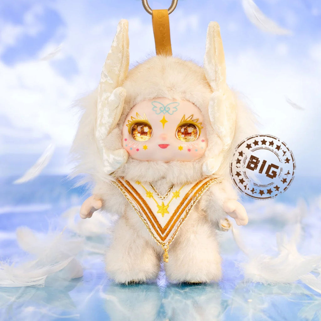 Plush toy with angelic design on a cloud background, featuring the brand 'BIG'.