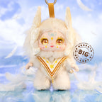 Plush toy with angelic design on a cloud background, featuring the brand 'BIG'.