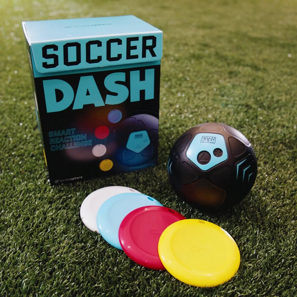 Soccer Dash game set with packaging, ball, and colorful discs on grass
