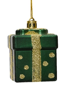 Green gift box ornament with gold ribbon and polka dots on a white background