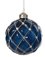 Blue glass ornament with silver lattice pattern on a white background