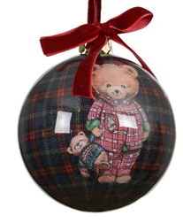 Decorative Christmas ball with a teddy bear design and red ribbon on a white background