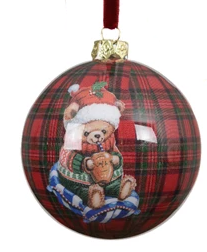 Decorative Christmas ornament with a teddy bear on a plaid background