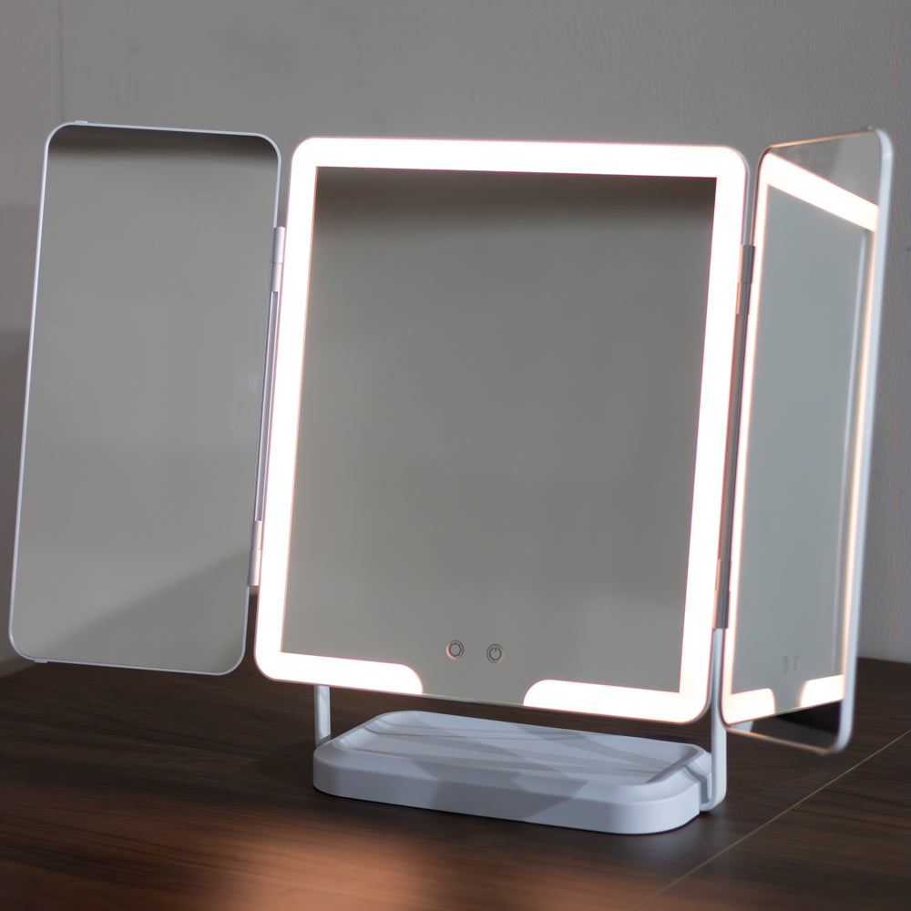 Hollywood Rechargeable Portable Mirror with LED lights on a wooden surface.