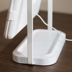 Hollywood Rechargeable Portable Mirror on a wooden surface with a blurred background