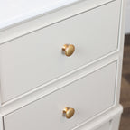 Monroe 2 Drawer Accent Table in Stonewith gold knobs on a neutral background