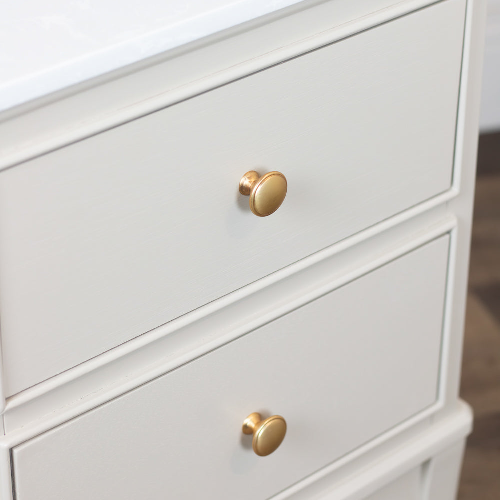 Monroe 2 Drawer Accent Table in Stonewith gold knobs on a neutral background