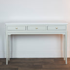 Monroe 3 Drawer Console Table in Stone  with three drawers against a white wall.