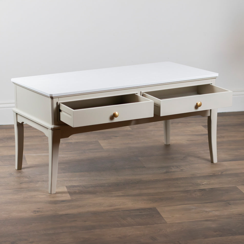 Monroe Coffee Table in Stone with two drawers on a wooden floor