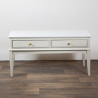 Monroe Coffee Table in Stone with two drawers on a wooden floor against a white wall