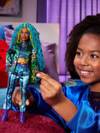 Child holding a doll with colorful hair and outfit in a room with purple curtains.