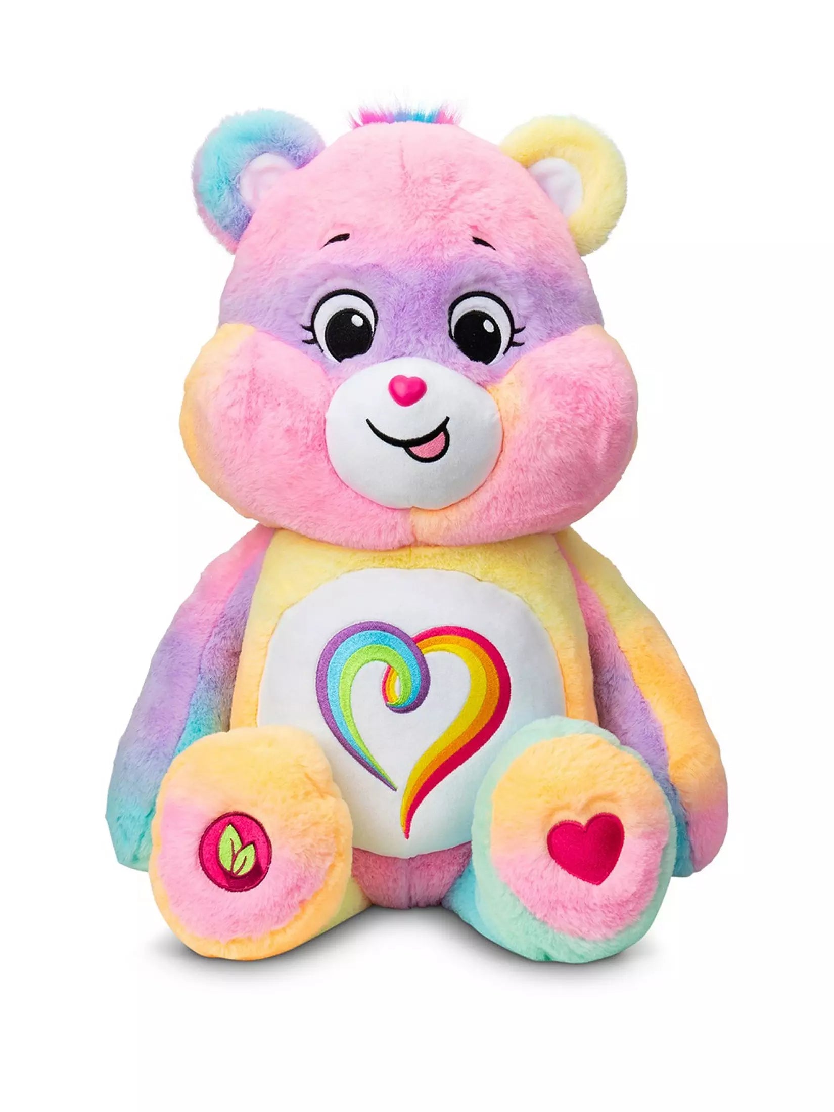 Colorful teddy bear plush toy with a heart design on a white background