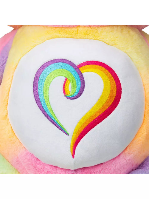 Plush toy with a rainbow heart design on a white background