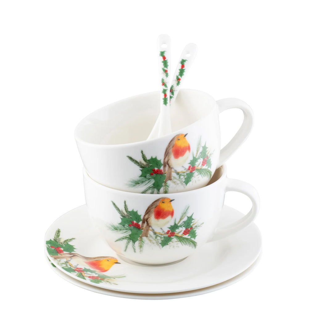 Teacup and saucer set with Christmas-themed design on a white background