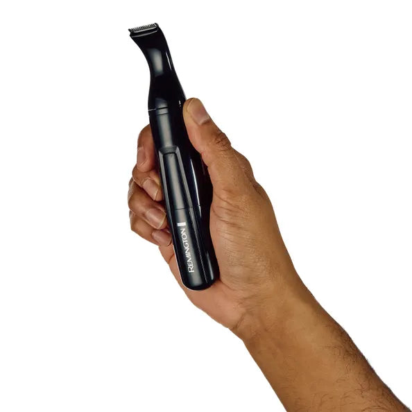 Hand holding a black trimmer with 'Remington' branding on a white background
