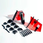 Set of black hair styling tools including clippers, scissors, and combs on a white background.