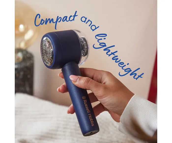 Hand holding a blue hair dryer with 'Compact and Lightweight' text on a blurred background