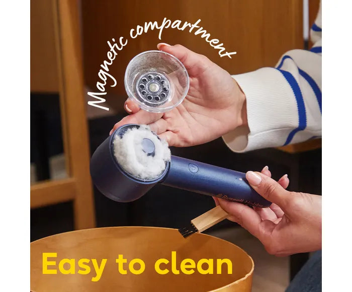 Person holding a blue handheld cleaning device with a clear compartment labeled 'Magnetic compartment' and text 'Easy to clean'.