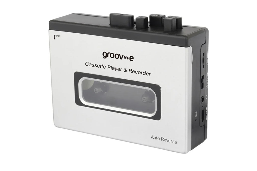 A white and black Groove cassette player and recorder device with a transparent cassette window, shown on a plain white background.