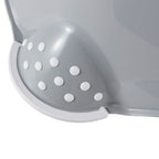 Gray colander with white polka dots on a white background