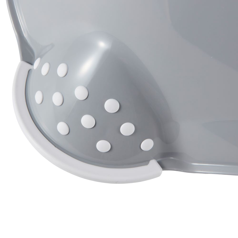 Gray colander with white polka dots on a white background