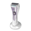 Purple and silver electric shaver on a white background