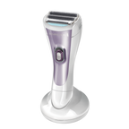 Purple and silver electric shaver on a white background